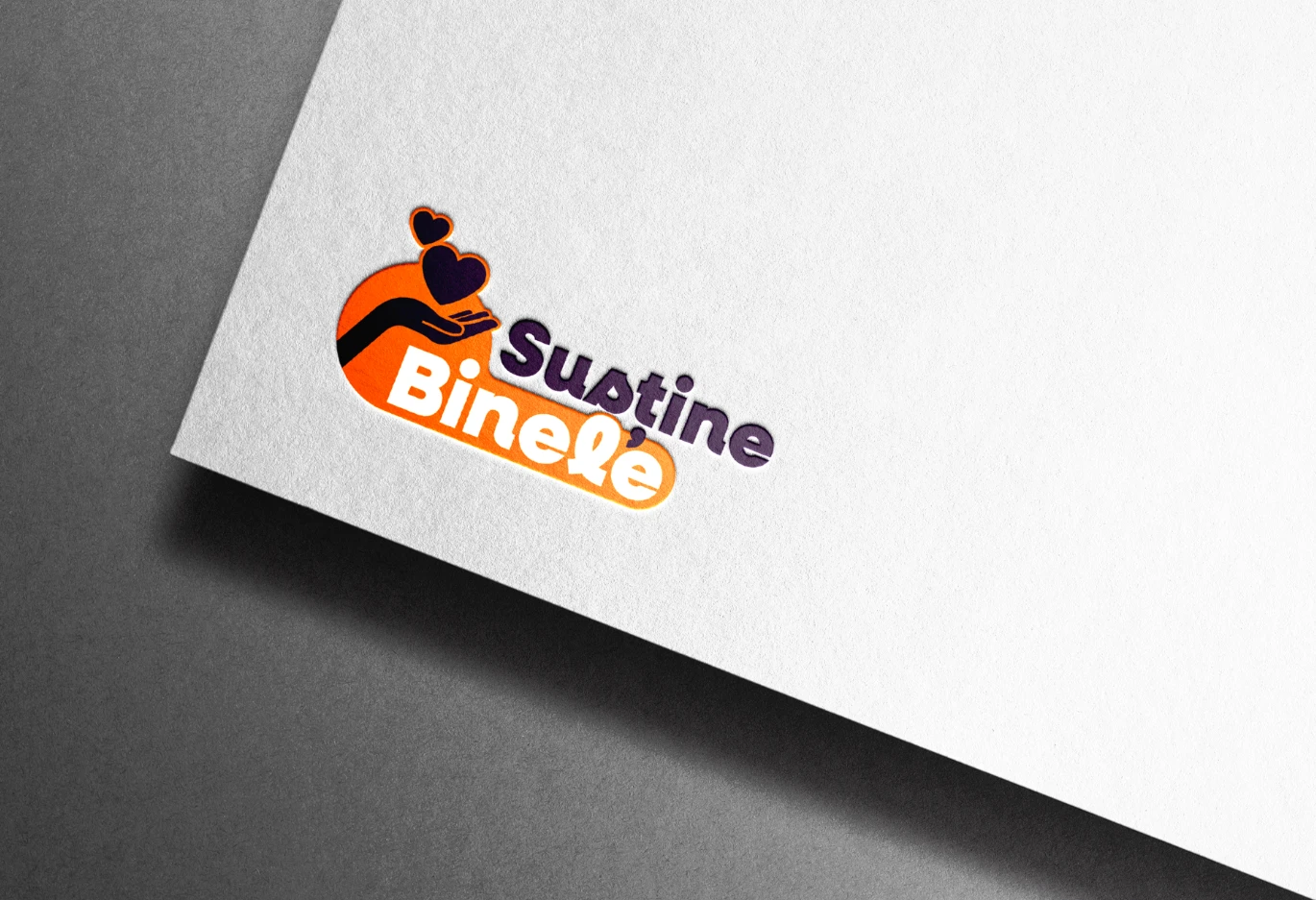Machetă de logo tipărit promovând bunătatea, cu o mână susținând inimi